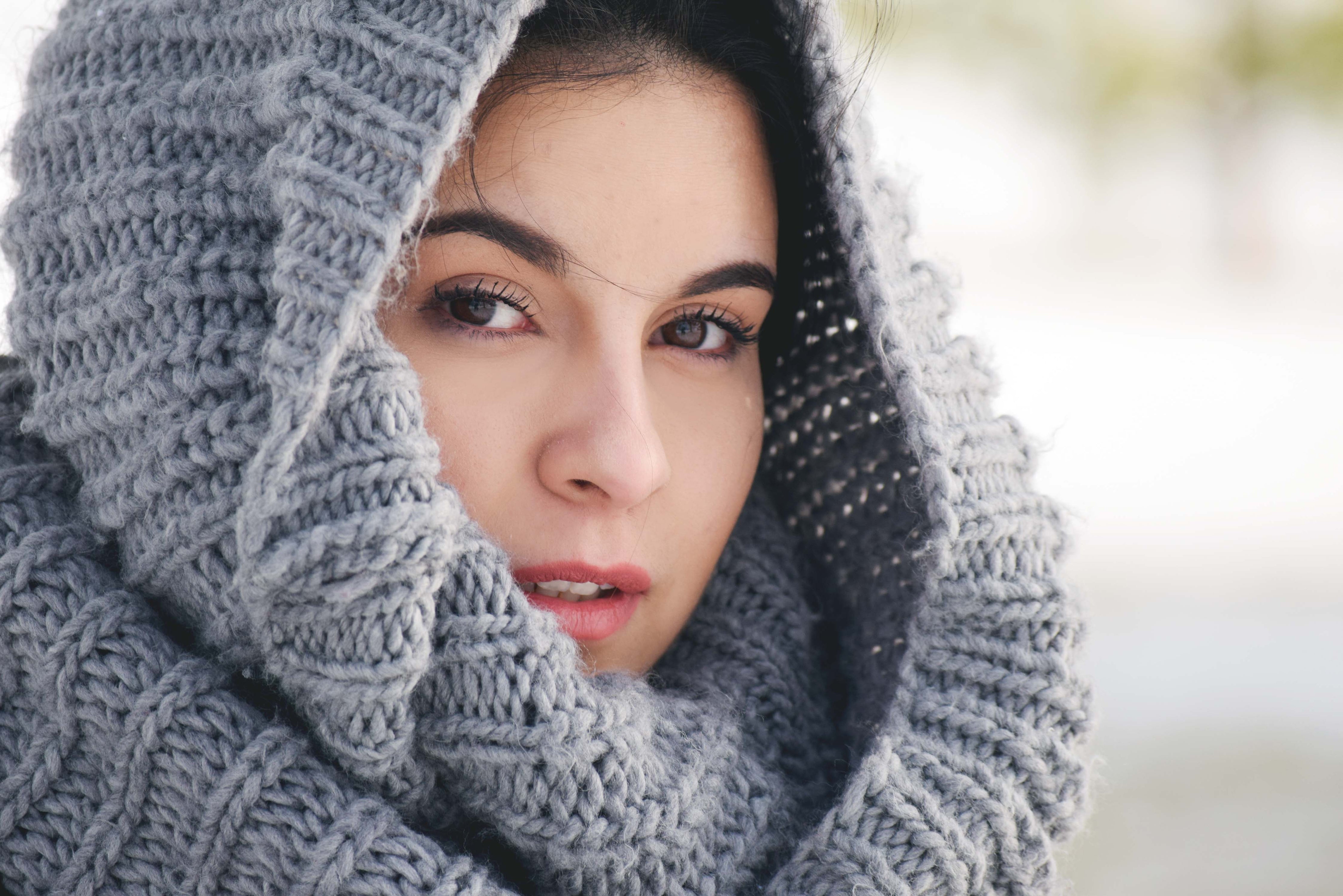 woman-draped-in-knit-scarf.jpg